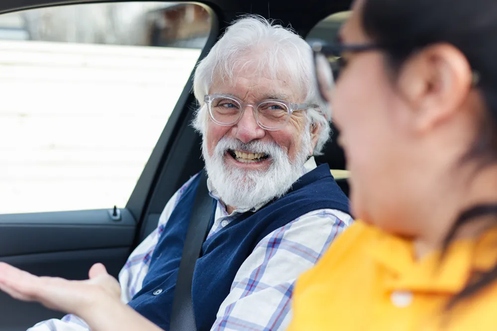 in-home care worker providing attentive support to a senior client