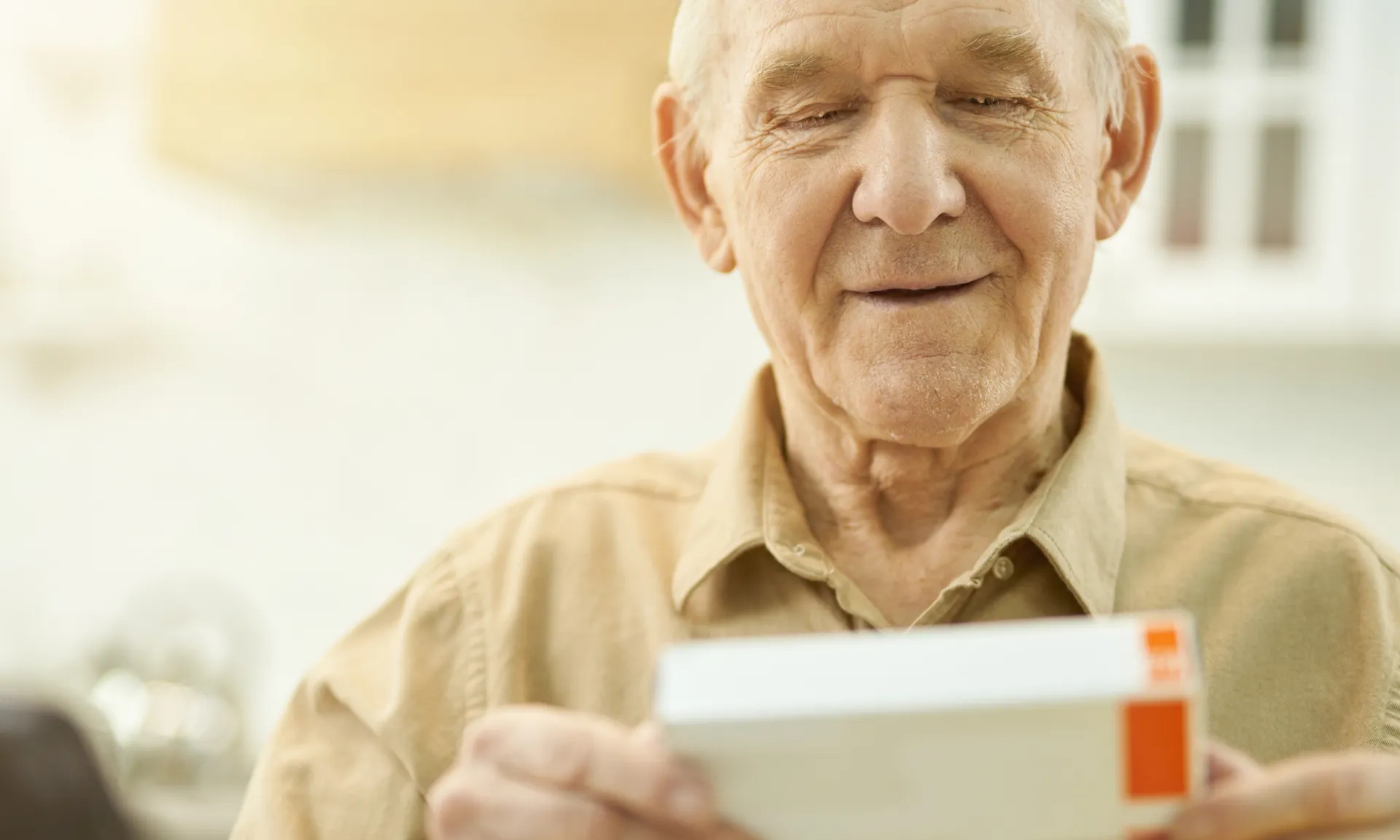 grandpa reading the label of his medication