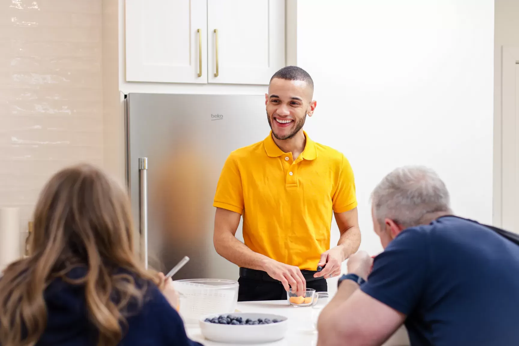caregiver helping in the kitchen